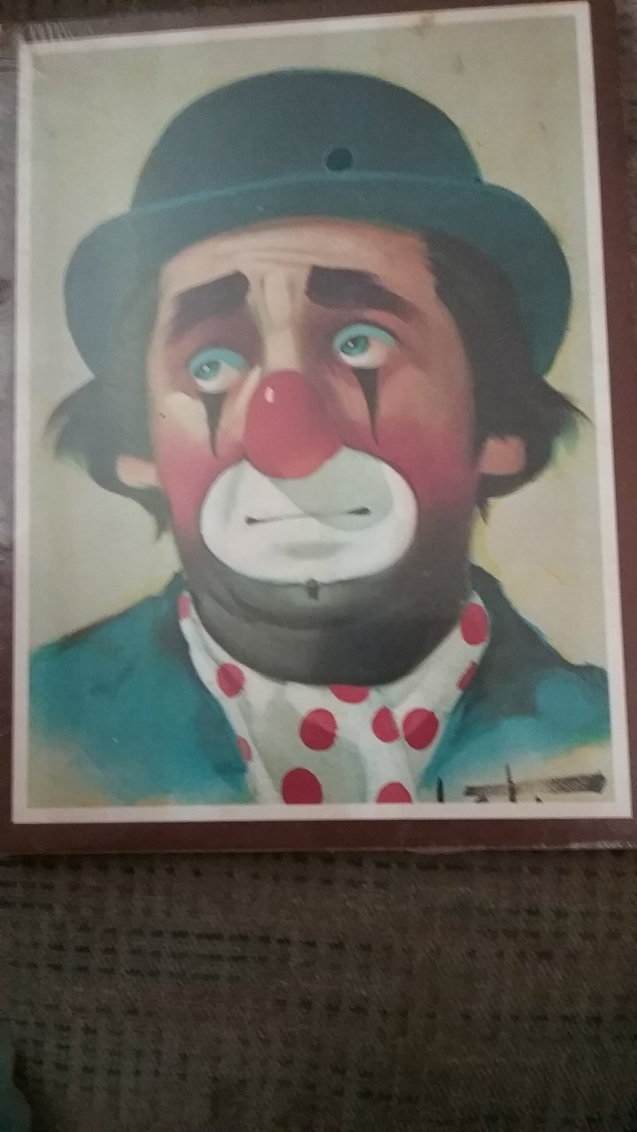 I Have This Painting Of A Sad Face Clown Is It Oil Painting And I See A