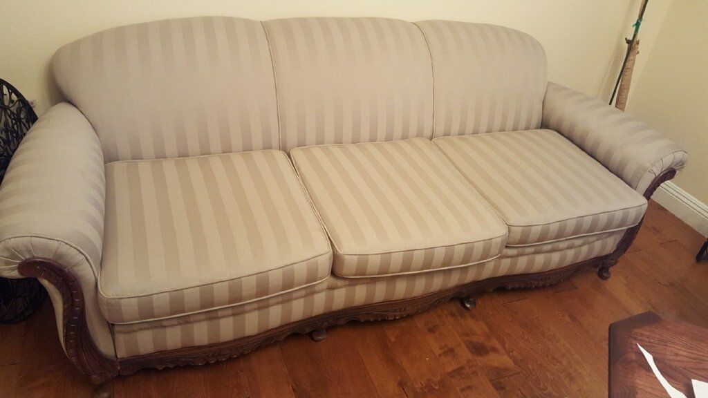 antique bed used as a sofa